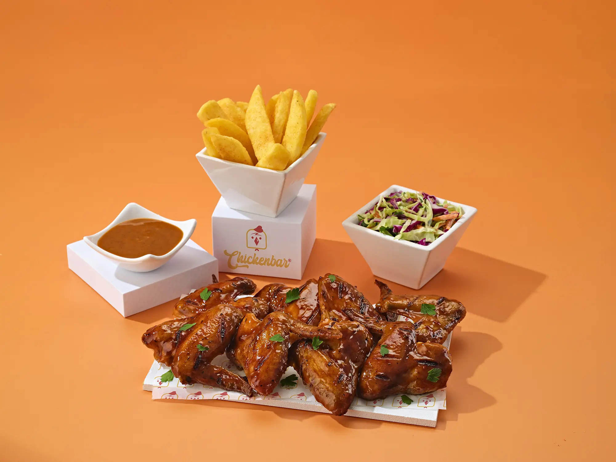 8 Chicken wings with a side of chips and salad
